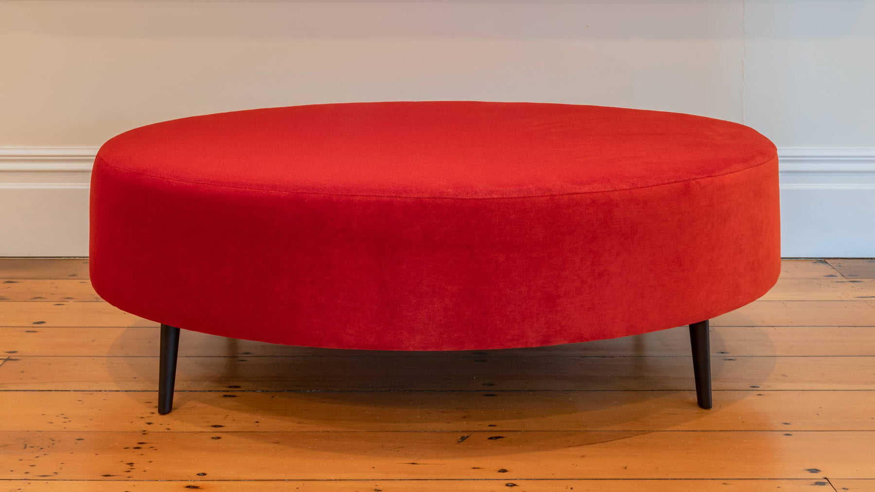Art gallery style ottoman in bright velvet