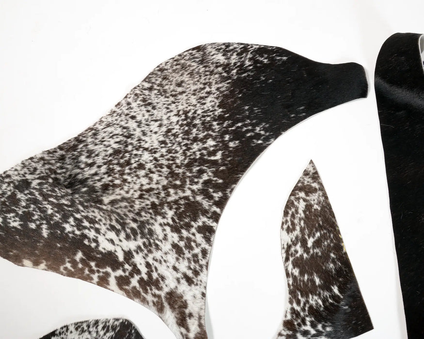 Close up of Leather pieces in black and white speckles 