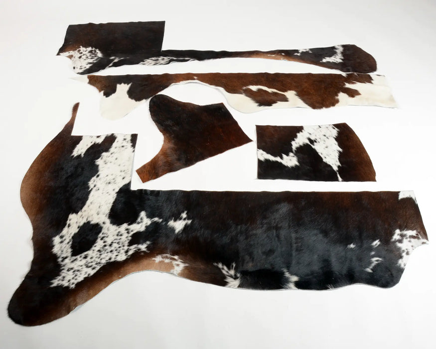 Reddish brown and white cow skin scraps for craft