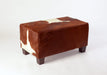 Small brown and white cowhide footstool