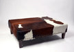 Beautiful large cowhide ottoman with studs