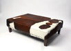 Beautiful cowhide ottoman with studs