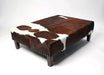 Beautiful cowhide ottoman with studs