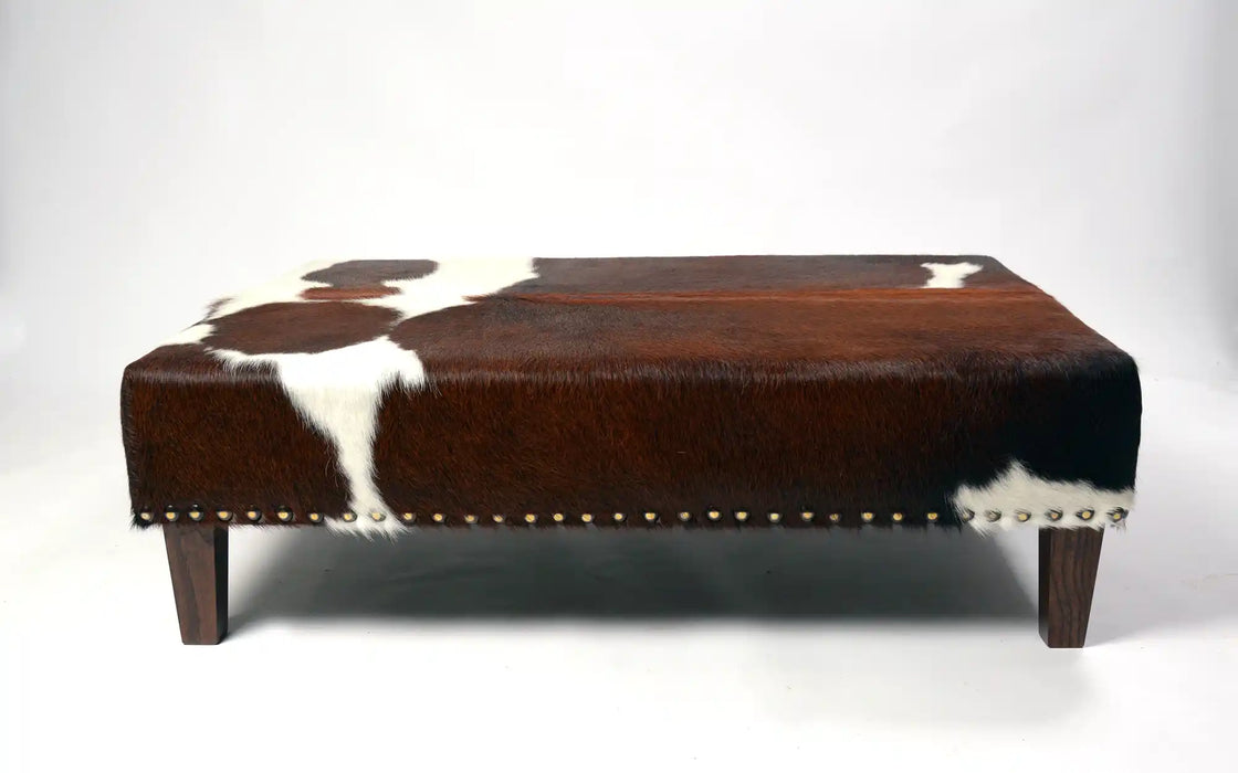 Beautiful cowhide ottoman with studs