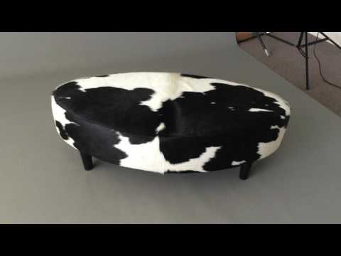Video of an oval cowhide ottoman