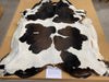 Chocolate brown and white cowhide rug