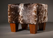Cowhide footstool with wood legs