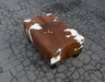 Brown Cowhide Footstool with Low Wood Legs