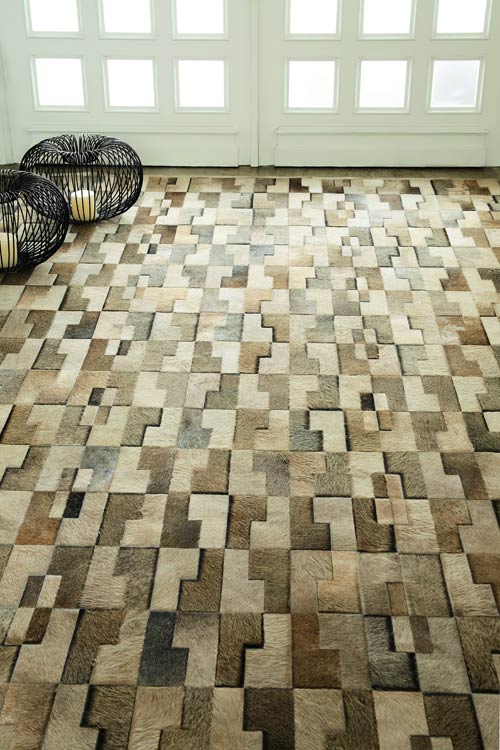 Beige cowhide patchwork rug