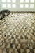 Beige cowhide patchwork rug