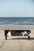 Long bench ottoman in cowhide with studs